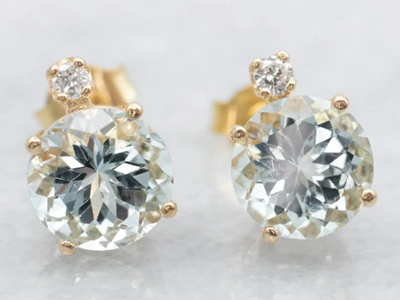 Ladies earrings winter sparkle designs-Aquamarine and Diamond Gold Stud Earrings