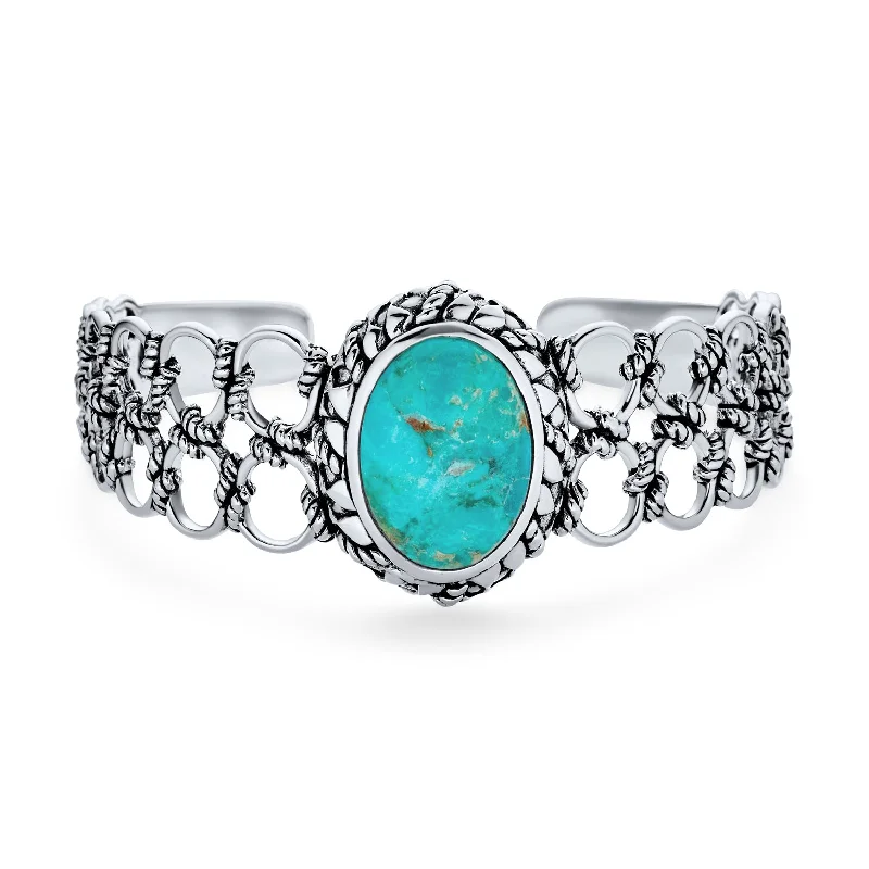 Ladies bracelets zodiac sign styles-Southwestern Turquoise Cabochon Gemstone Cuff Bracelet in Sterling Silver