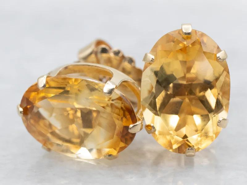 Ladies earrings stainless steel options-Oval-Cut Citrine Stud Earrings