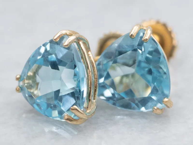 Ladies earrings soft touch styles-Trillion Cut Blue Topaz Stud Earrings