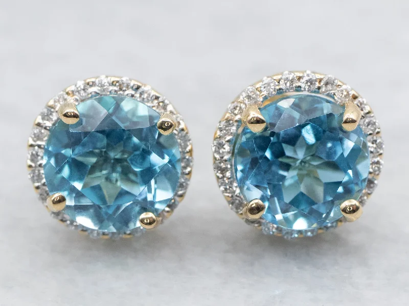 Ladies earrings baguette cut designs-Yellow Gold Blue Topaz and Diamond Halo Stud Earrings