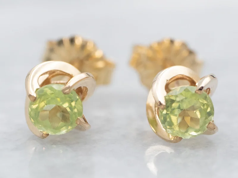 Ladies earrings soft curve earrings-Yellow Gold Peridot Swirl Stud Earrings