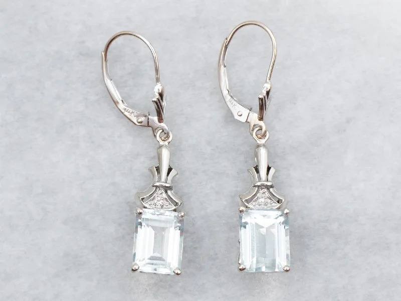 Ladies earrings starburst style picks-White Gold Emerald Cut Blue Topaz Drop Earrings with Diamond Accent